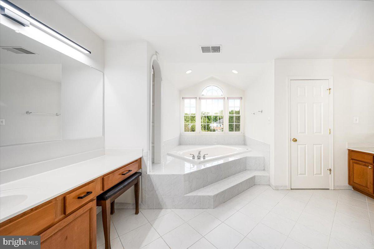 15205 Lions Den Road Burtonsville, MD 20866 - Photo 20 of 31 a spacious bathroom with a tub and a large window
