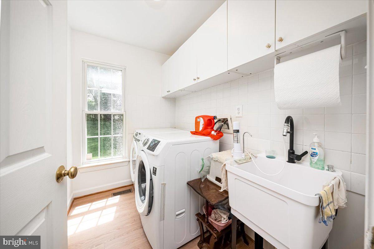 15205 Lions Den Road Burtonsville, MD 20866 - Photo 25 of 31 a utility room with dryer and washer