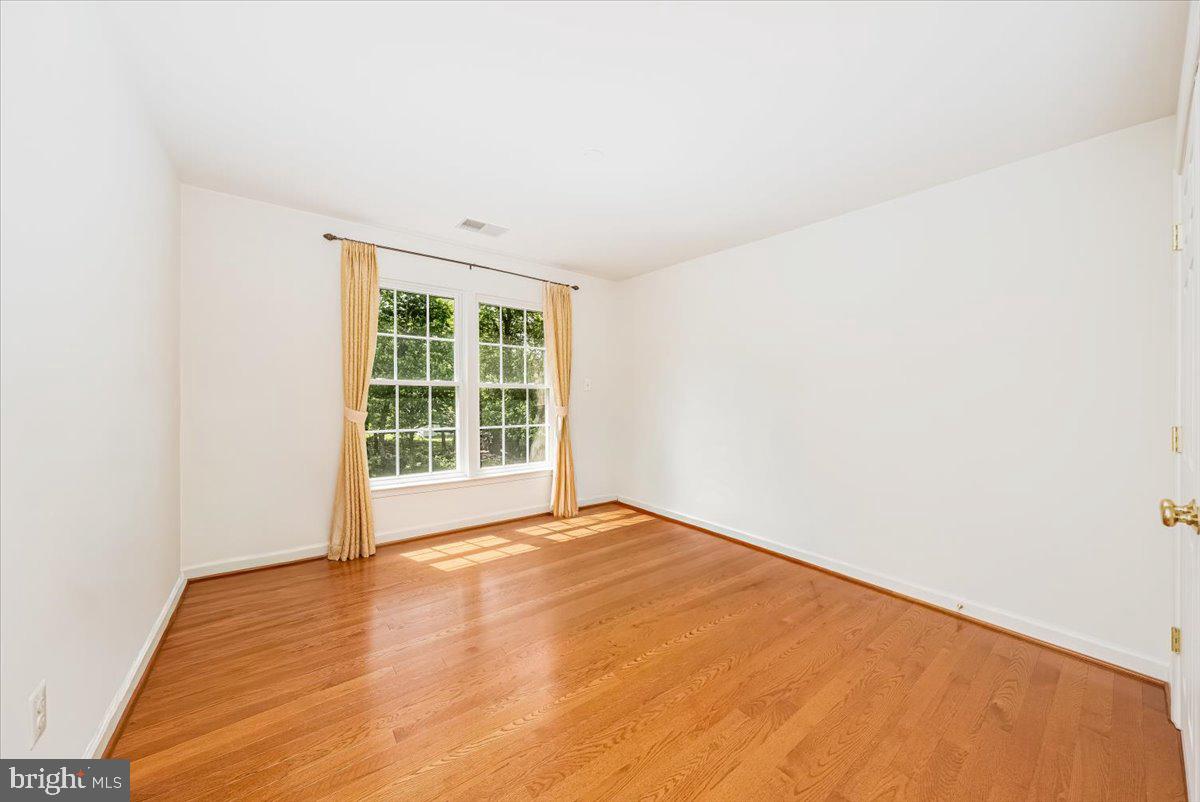15205 Lions Den Road Burtonsville, MD 20866 - Photo 26 of 31 a view of an empty room with a window