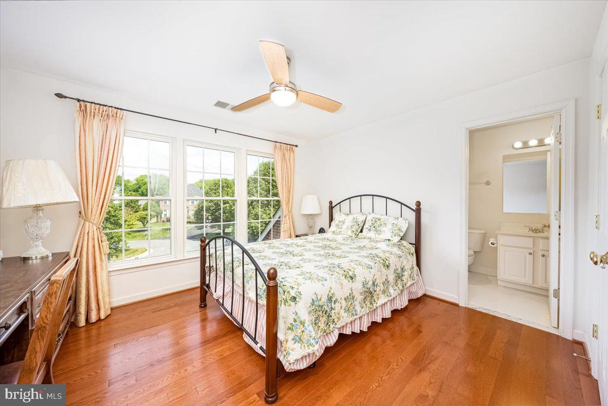 15205 Lions Den Road Burtonsville, MD 20866 - Photo 28 of 31 a bedroom with a bed and a large window