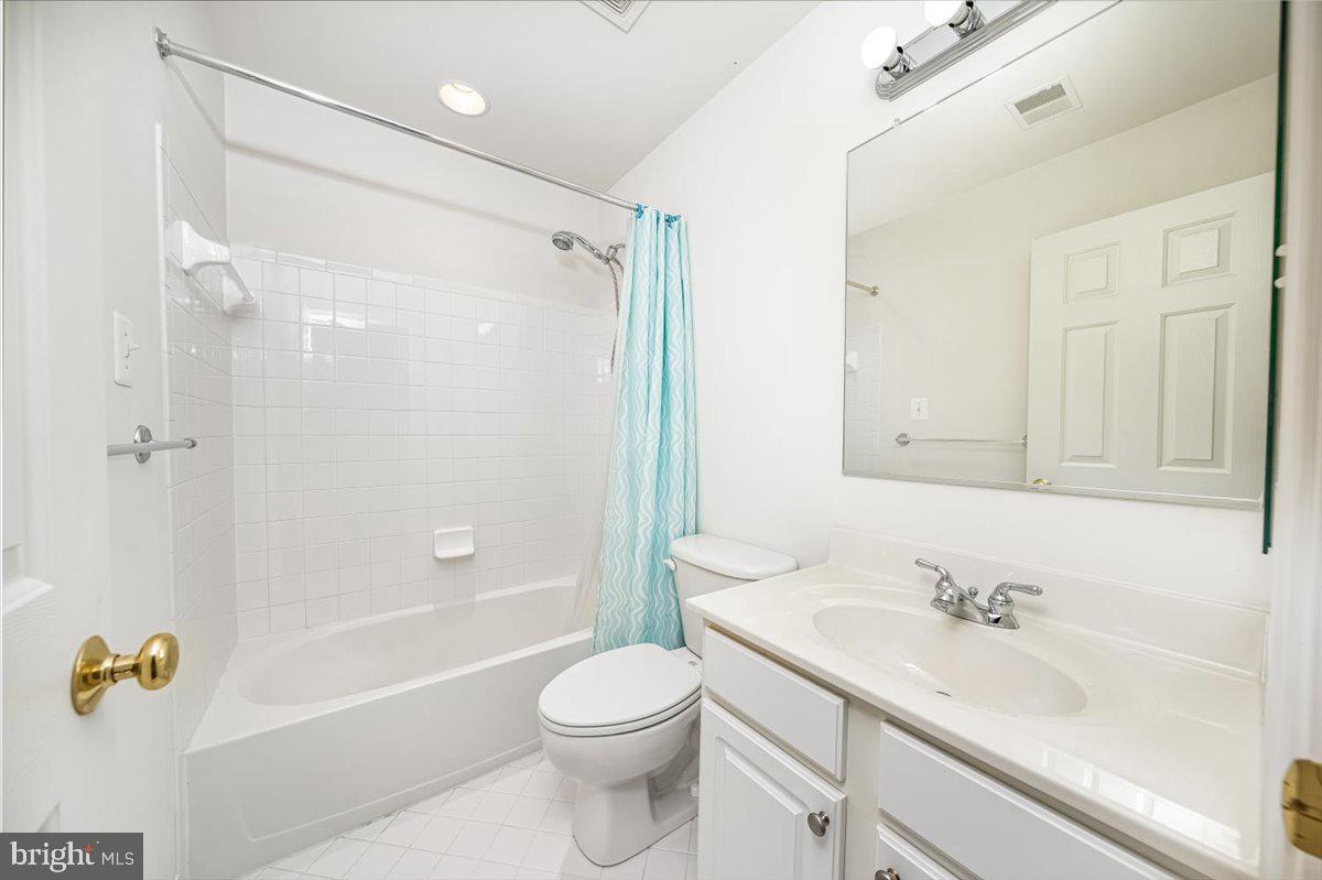 15205 Lions Den Road Burtonsville, MD 20866 - Photo 29 of 31 a bathroom with a sink a toilet and shower