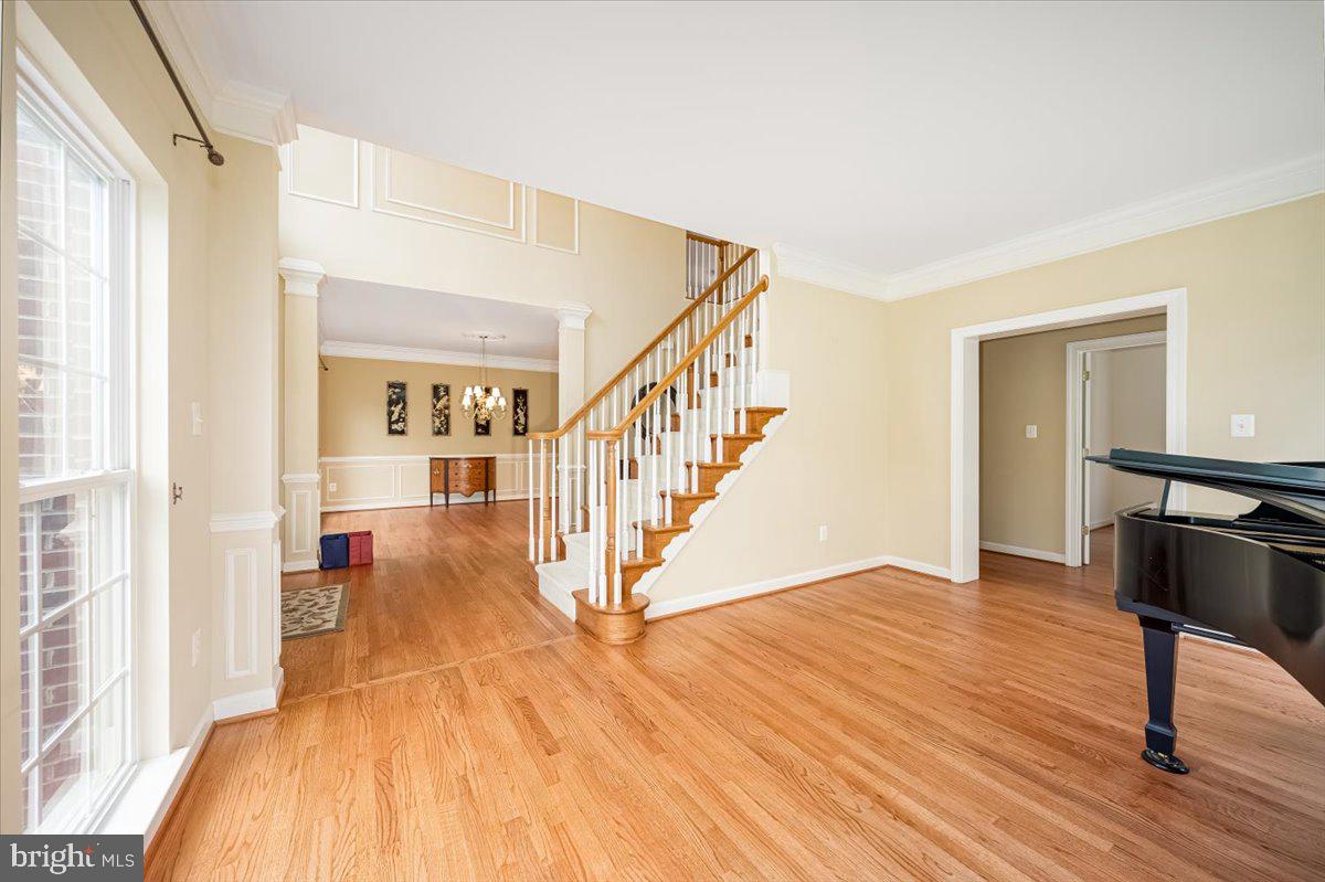 15205 Lions Den Road Burtonsville, MD 20866 - Photo 5 of 31 a view of a livingroom with wooden floor and stairs