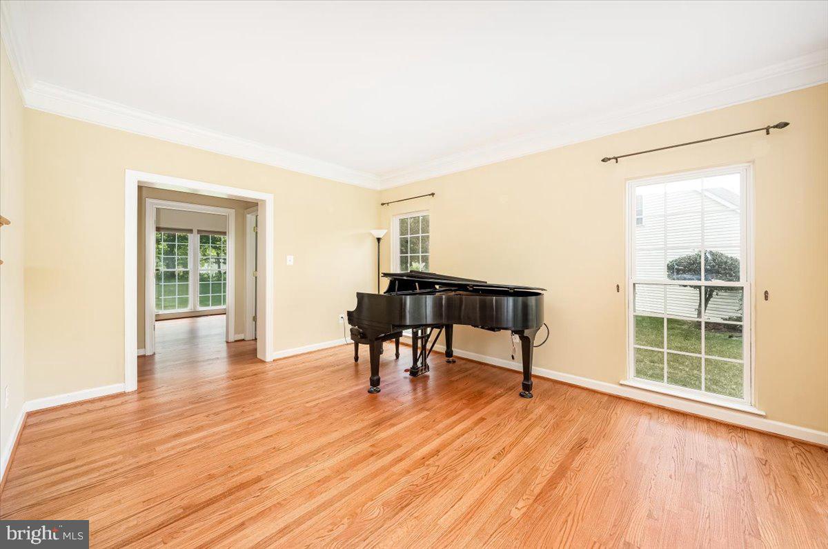 15205 Lions Den Road Burtonsville, MD 20866 - Photo 6 of 31 a view of a livingroom with furniture and wooden floor