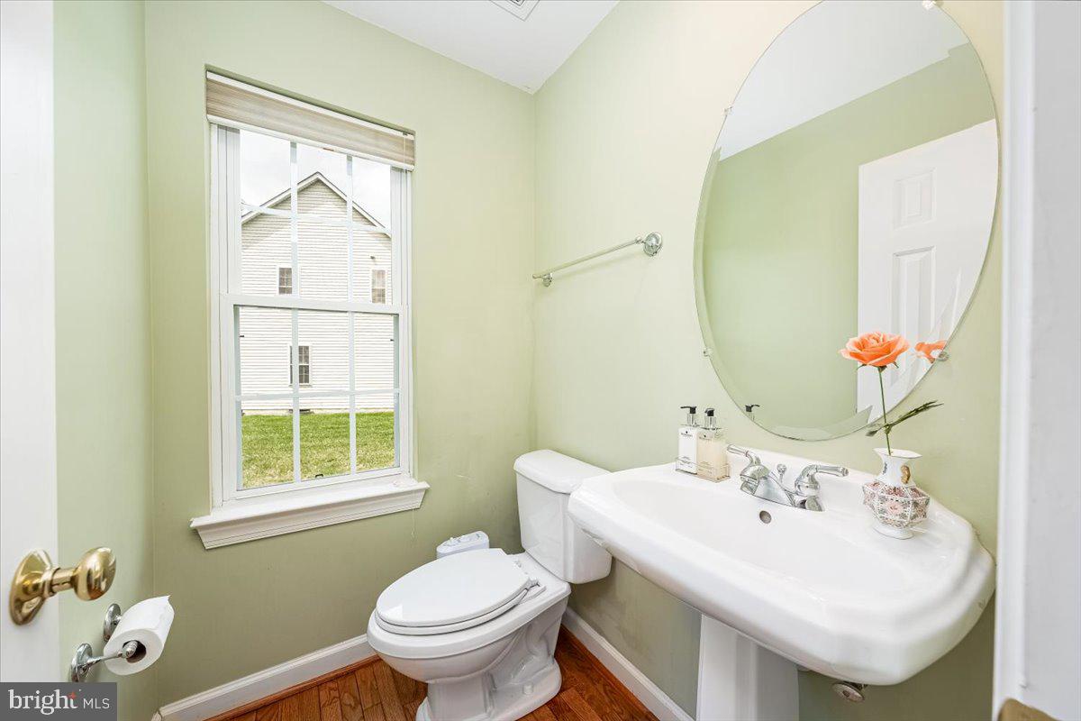 15205 Lions Den Road Burtonsville, MD 20866 - Photo 10 of 31 a bathroom with a sink and a toilet