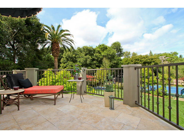 49 Lowery Drive Atherton, CA 94027 - Photo 15 of 25 a view of a chair and tables in the patio