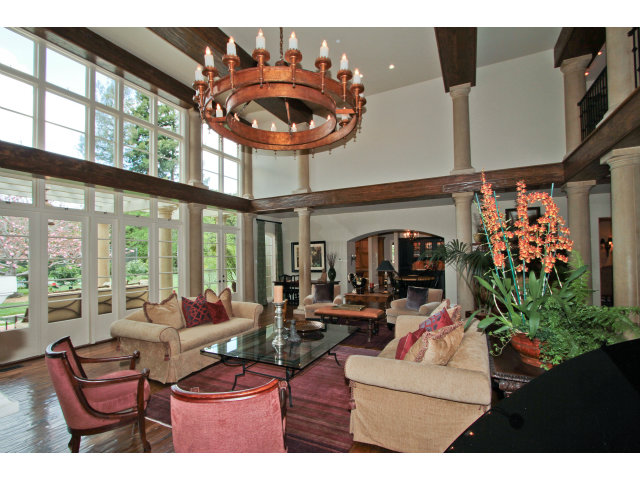 49 Lowery Drive Atherton, CA 94027 - Photo 6 of 25 a living room with furniture a floor to ceiling window and a flat screen tv
