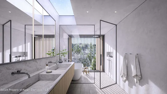 a spacious bathroom with a double vanity sink and a tub