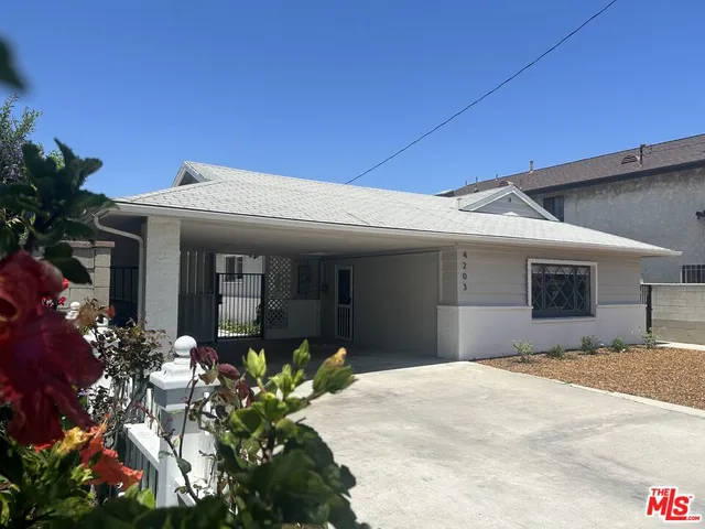 a front view of a house with a garage