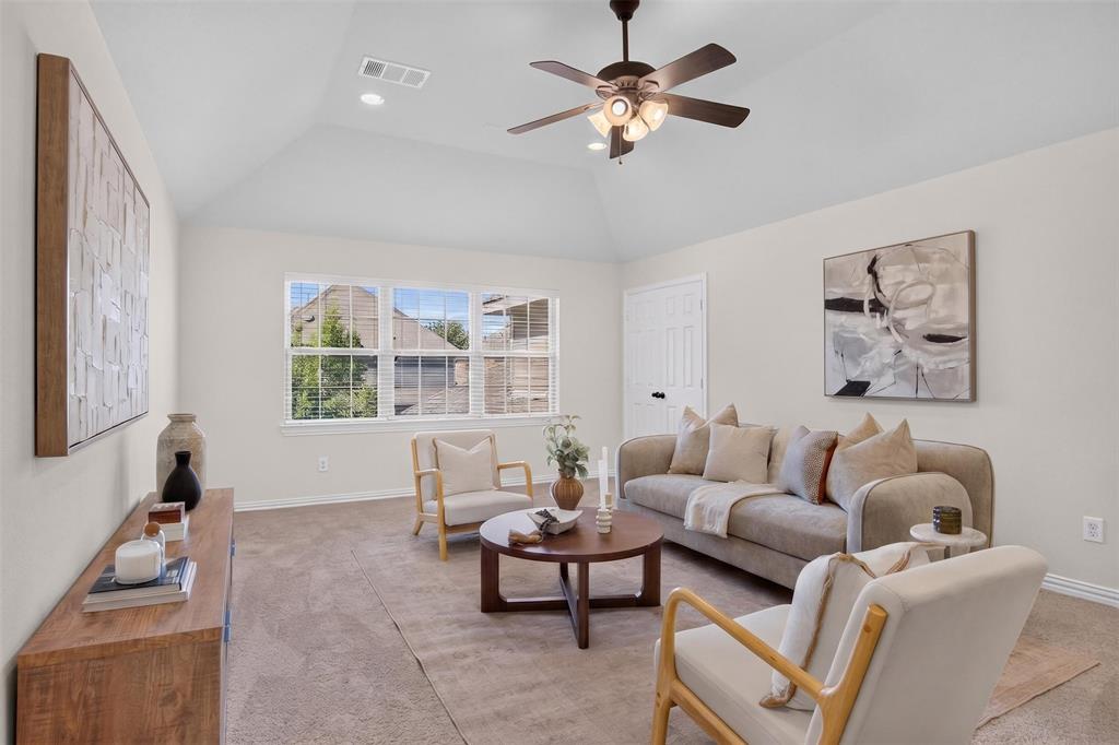 842 Sun Meadow Road Allen, TX 75013 - Photo 19 of 39 Spacious living area featuring a vaulted ceiling with a ceiling fan, recessed lighting, and light-colored carpet flooring