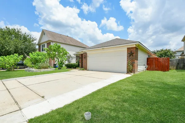 a front view of a house with yard