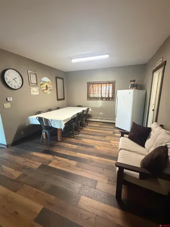 a bedroom with a bed and a table in it