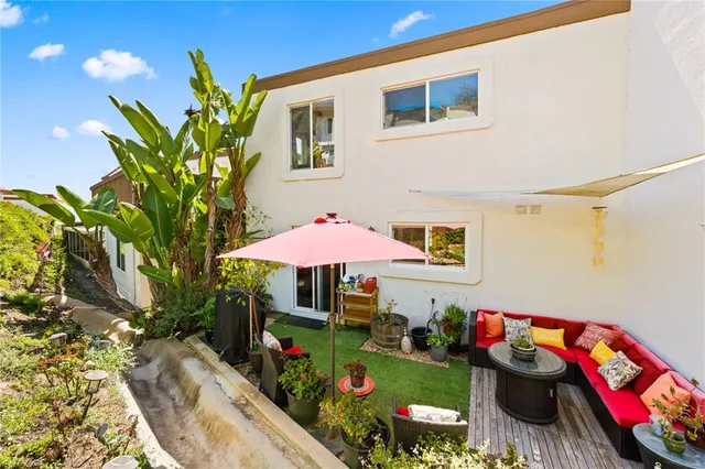 a view of a chairs and tables in a patio