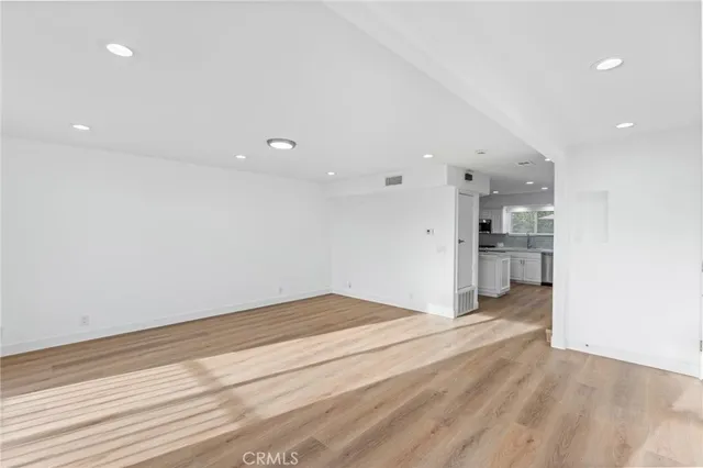 a view of kitchen and empty room