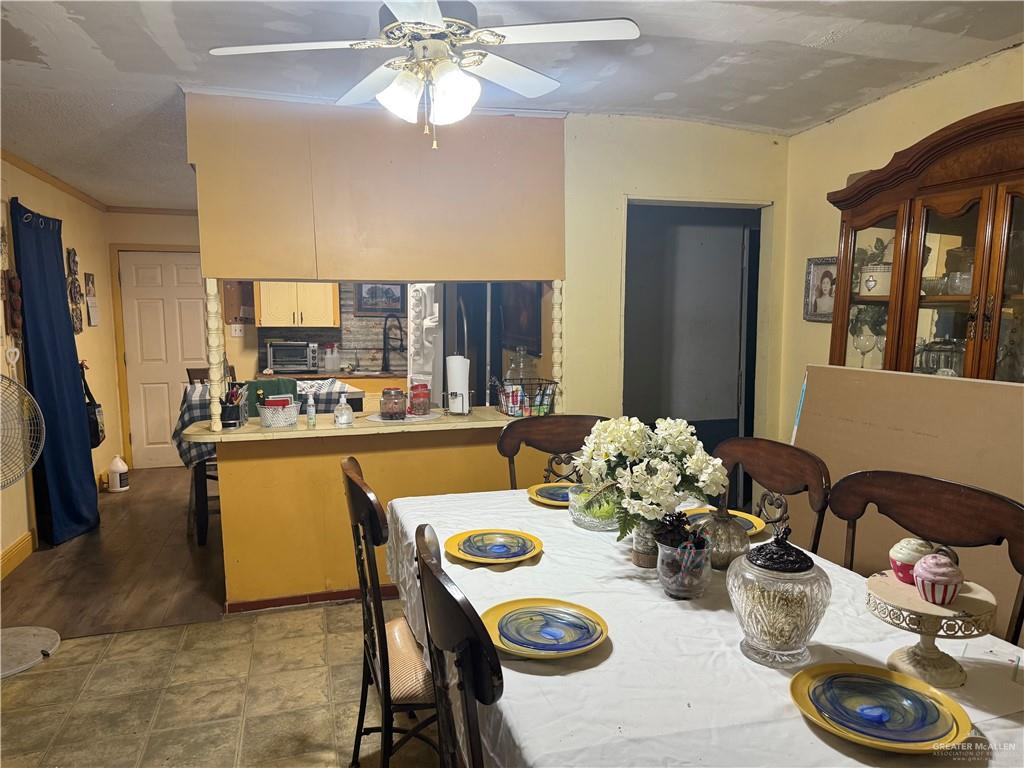 815 South Breyfogle Road Mission, TX 78572 - Photo 2 of 5 Dining space with a ceiling fan and crown molding