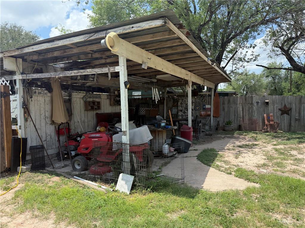 815 South Breyfogle Road Mission, TX 78572 - Photo 4 of 5 View of patio featuring a pole building and an outbuilding