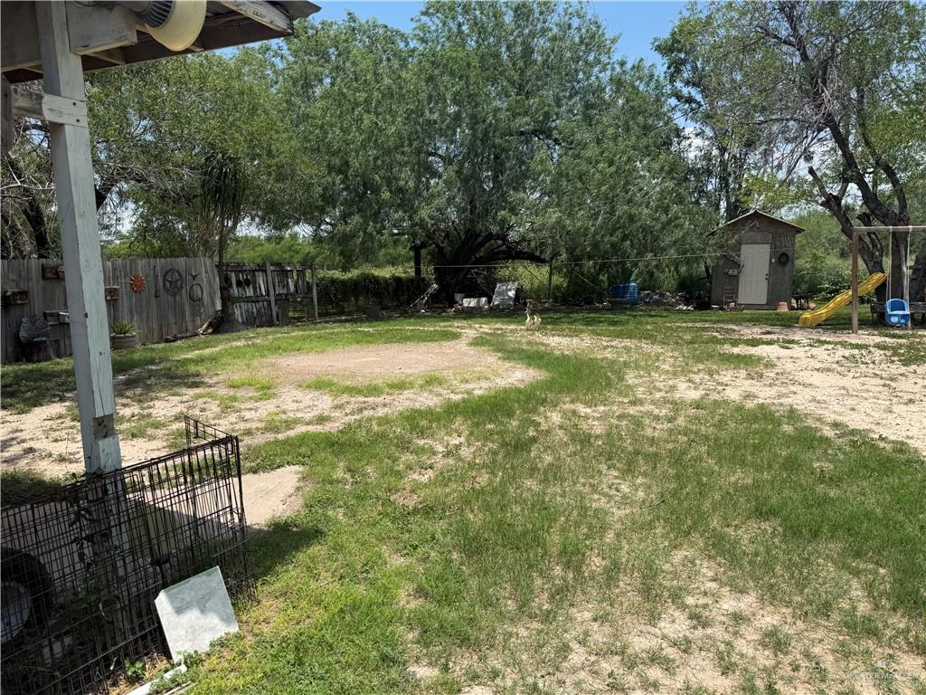 815 South Breyfogle Road Mission, TX 78572 - Photo 5 of 5 View of yard featuring a shed