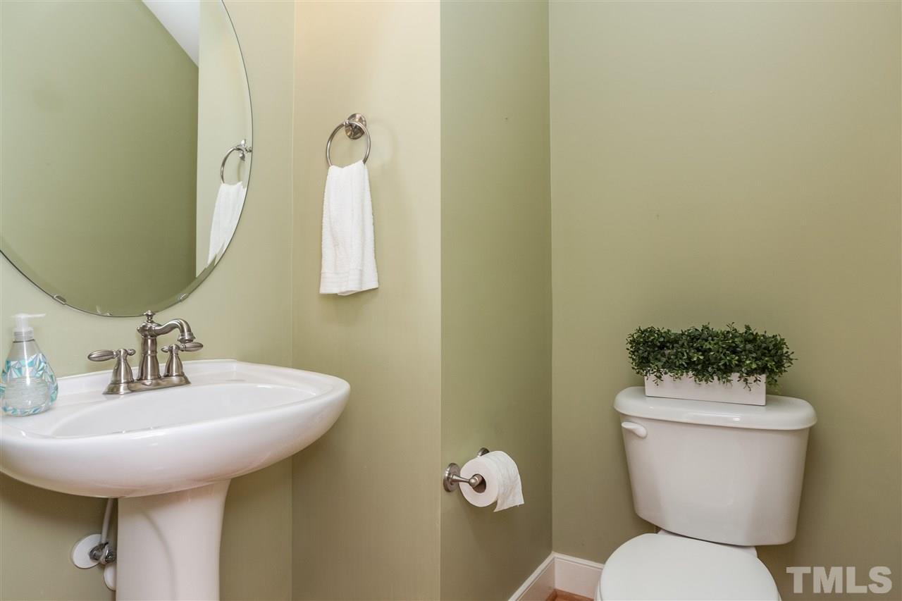 2224 Dunlin Lane Raleigh, NC 27614 - Photo 13 of 23 a bathroom with a toilet sink and mirror