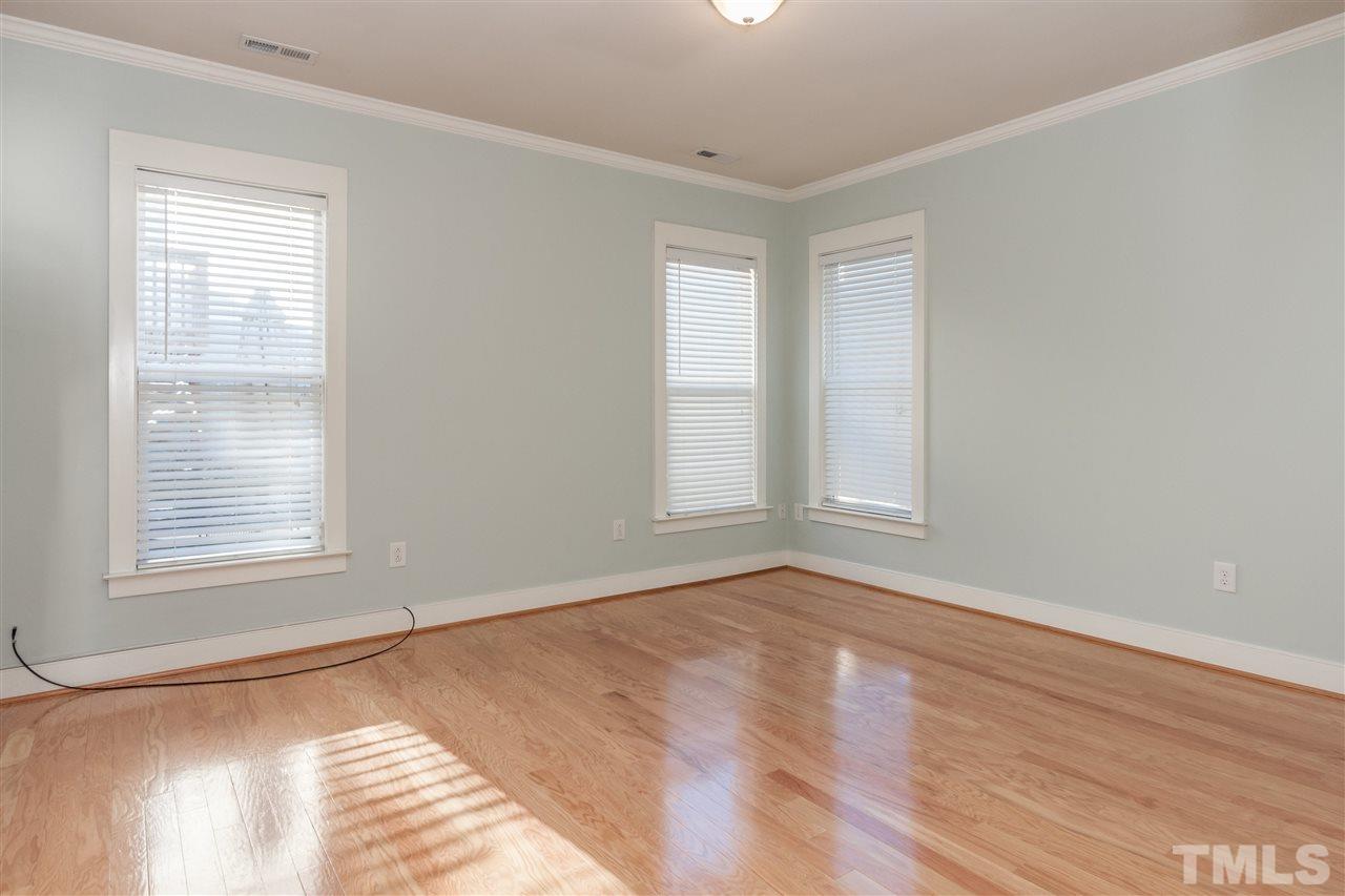 2224 Dunlin Lane Raleigh, NC 27614 - Photo 14 of 23 a view of an empty room with wooden floor and a window