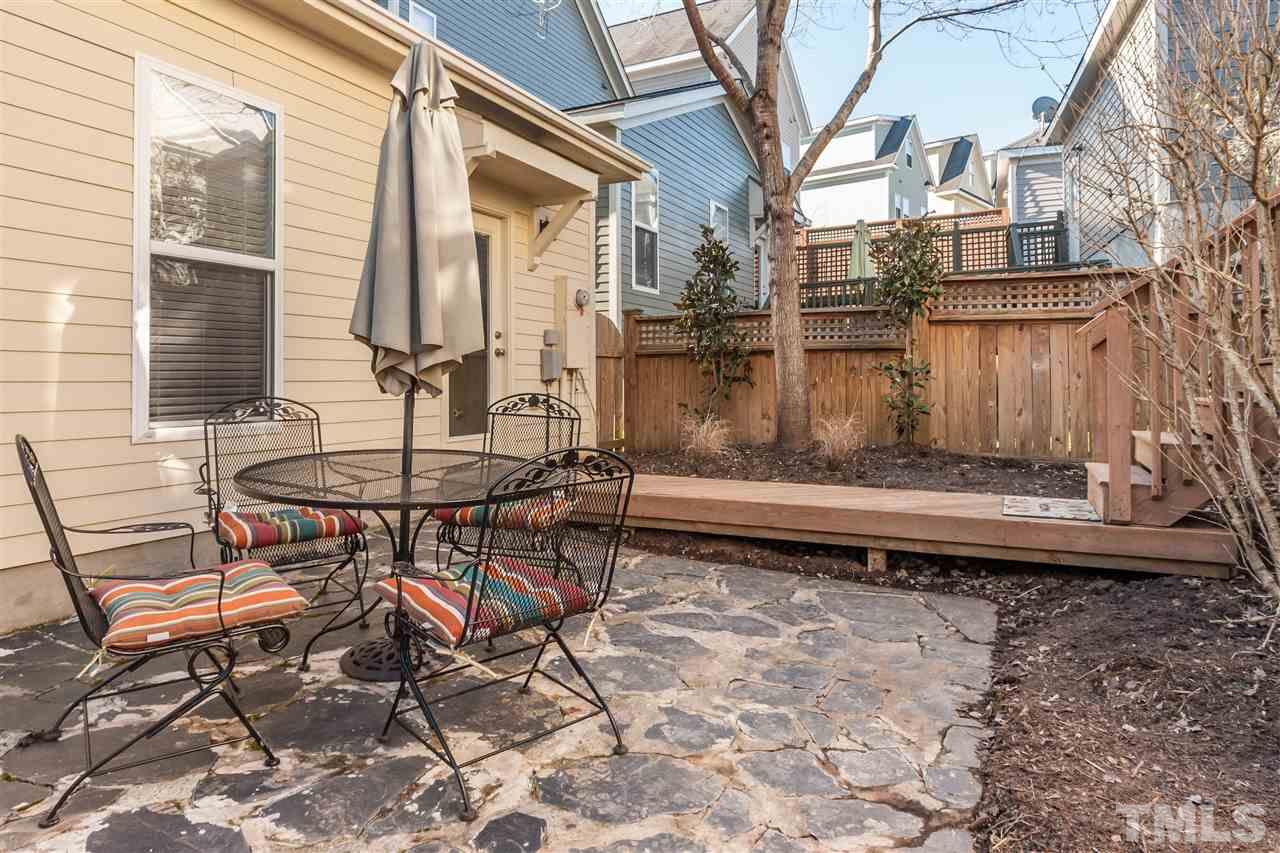2224 Dunlin Lane Raleigh, NC 27614 - Photo 22 of 23 a view of backyard with a table and chairs