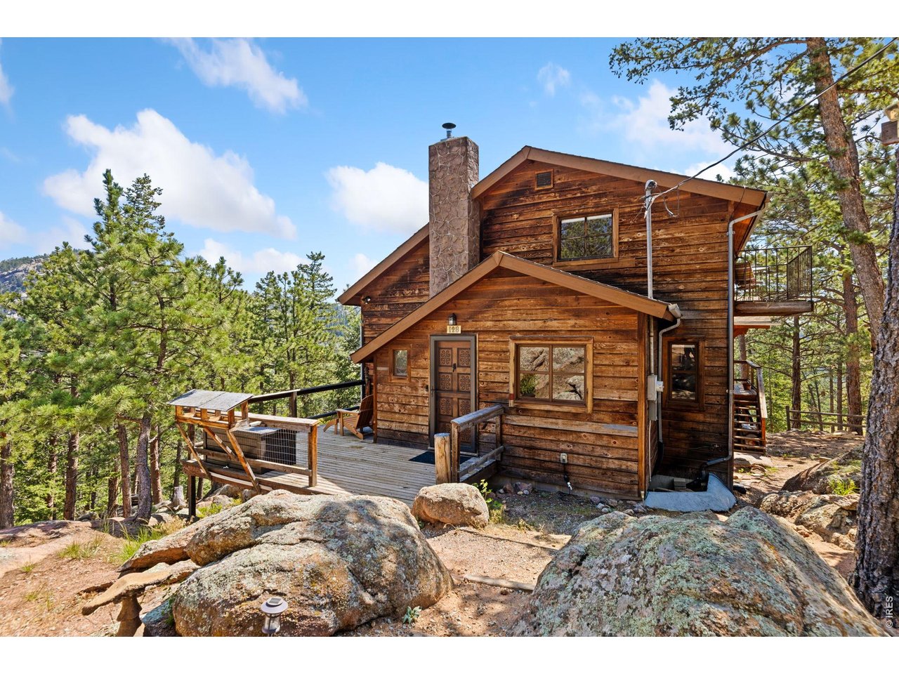 128 Elk Road Lyons, CO 80540 - Photo 2 of 50 Front door with deck and beautiful rock outcroppings
