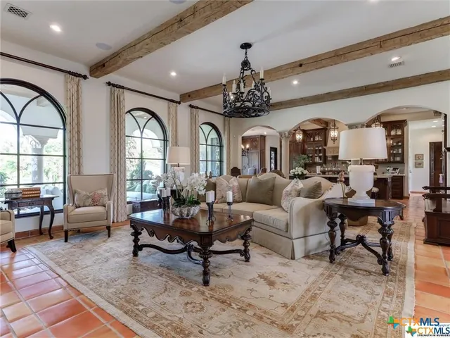 a view of a chairs and tables in the back yard of the house