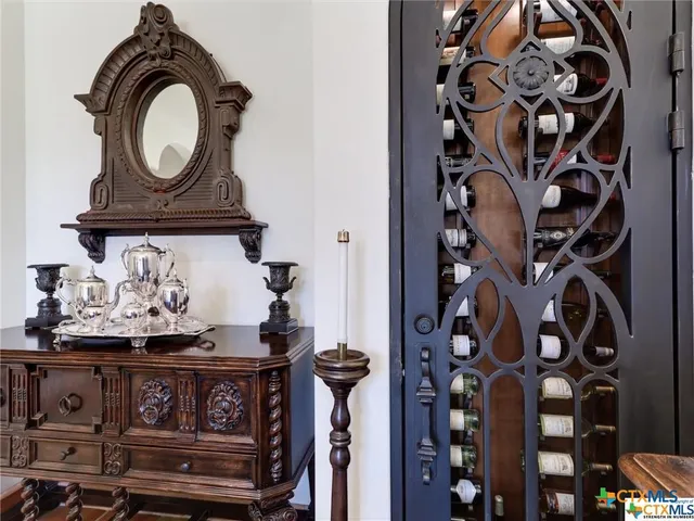 a kitchen with a counter space a sink appliances and cabinets