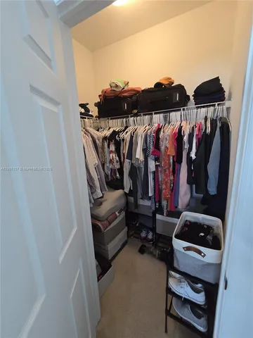 a bedroom with a bed and a tv