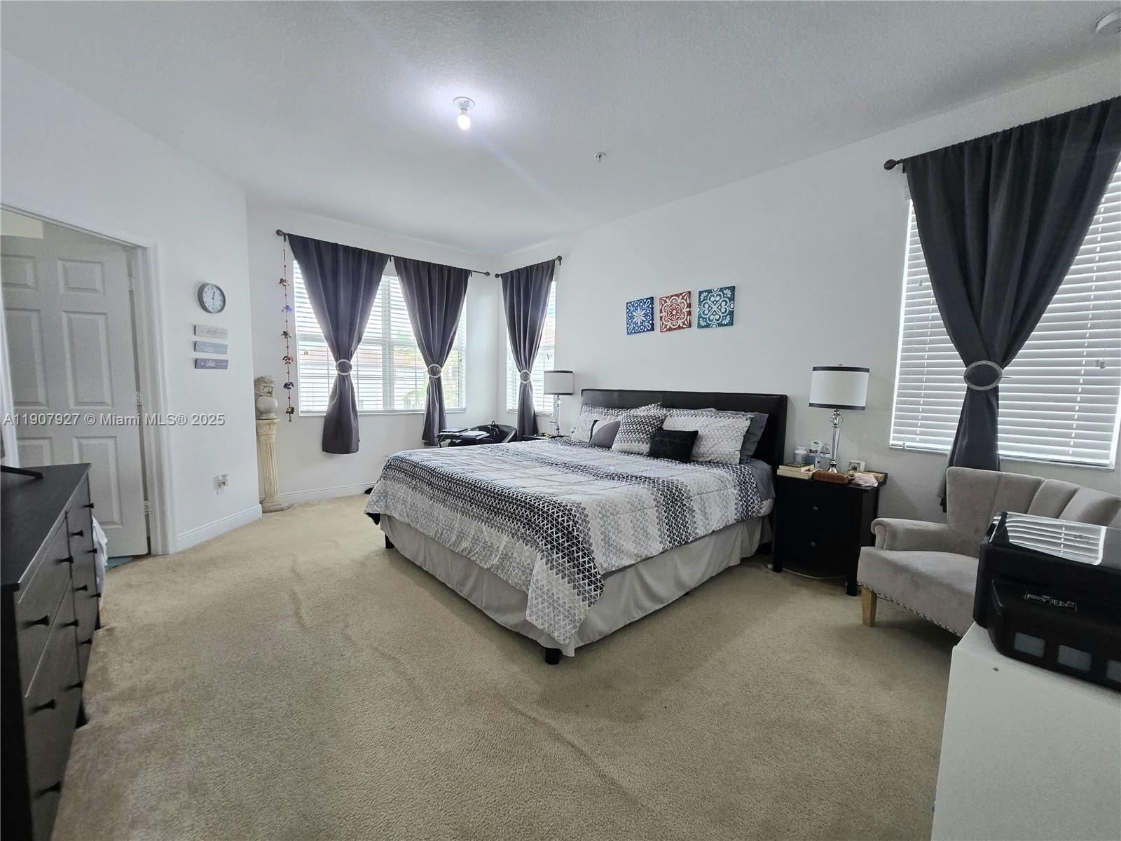 11938 Southwest 26th Court Miramar, FL 33025 - Photo 36 of 61 a bedroom with a bed couch and window