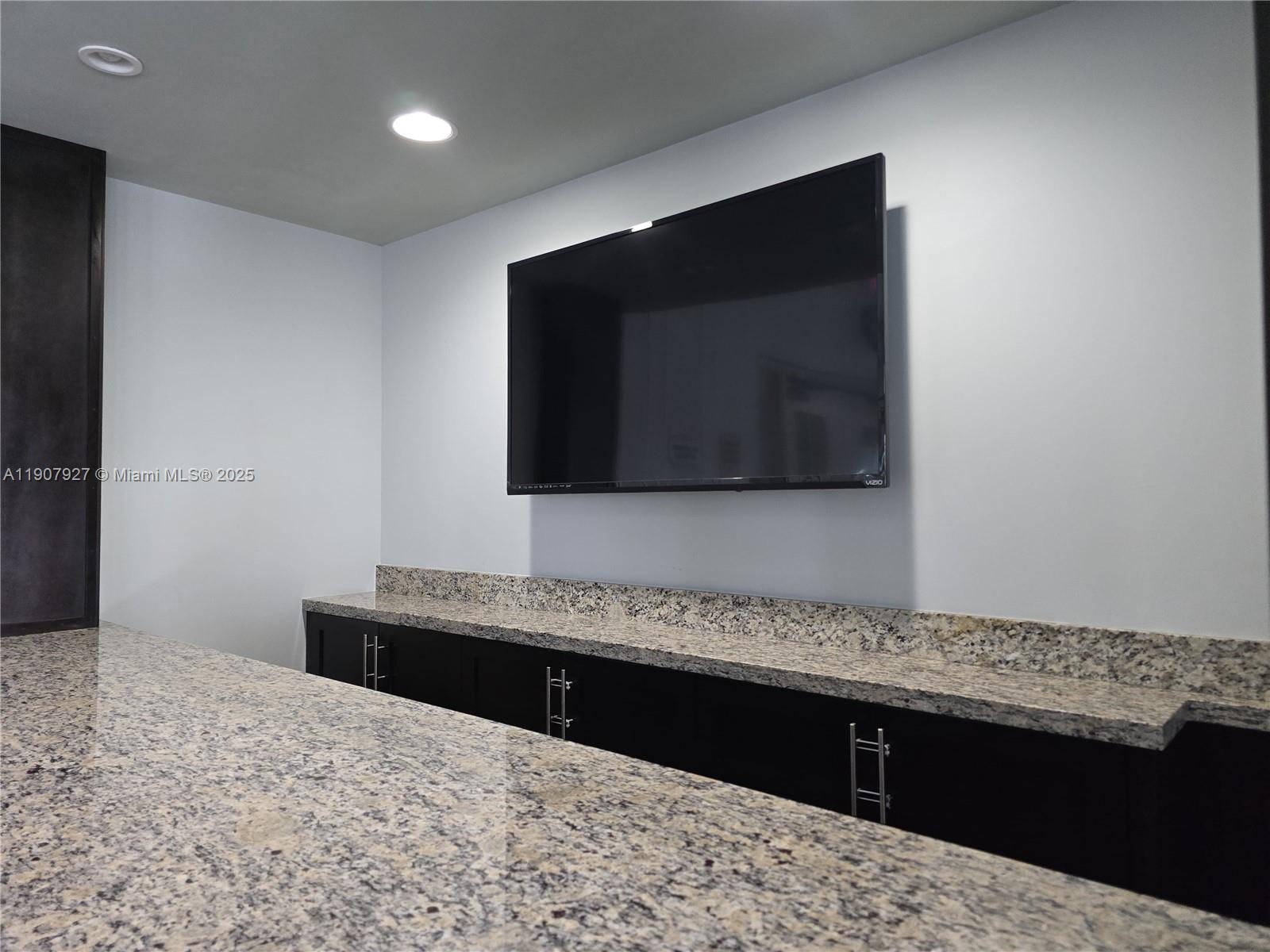 11938 Southwest 26th Court Miramar, FL 33025 - Photo 57 of 61 a bathroom with a sink and a mirror