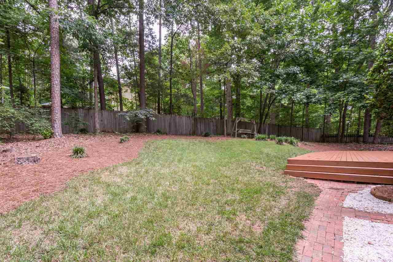 5200 Country Trail Raleigh, NC 27613 - Photo 21 of 25 Grassy backyard for playing, entertaining, pets and a small garden.