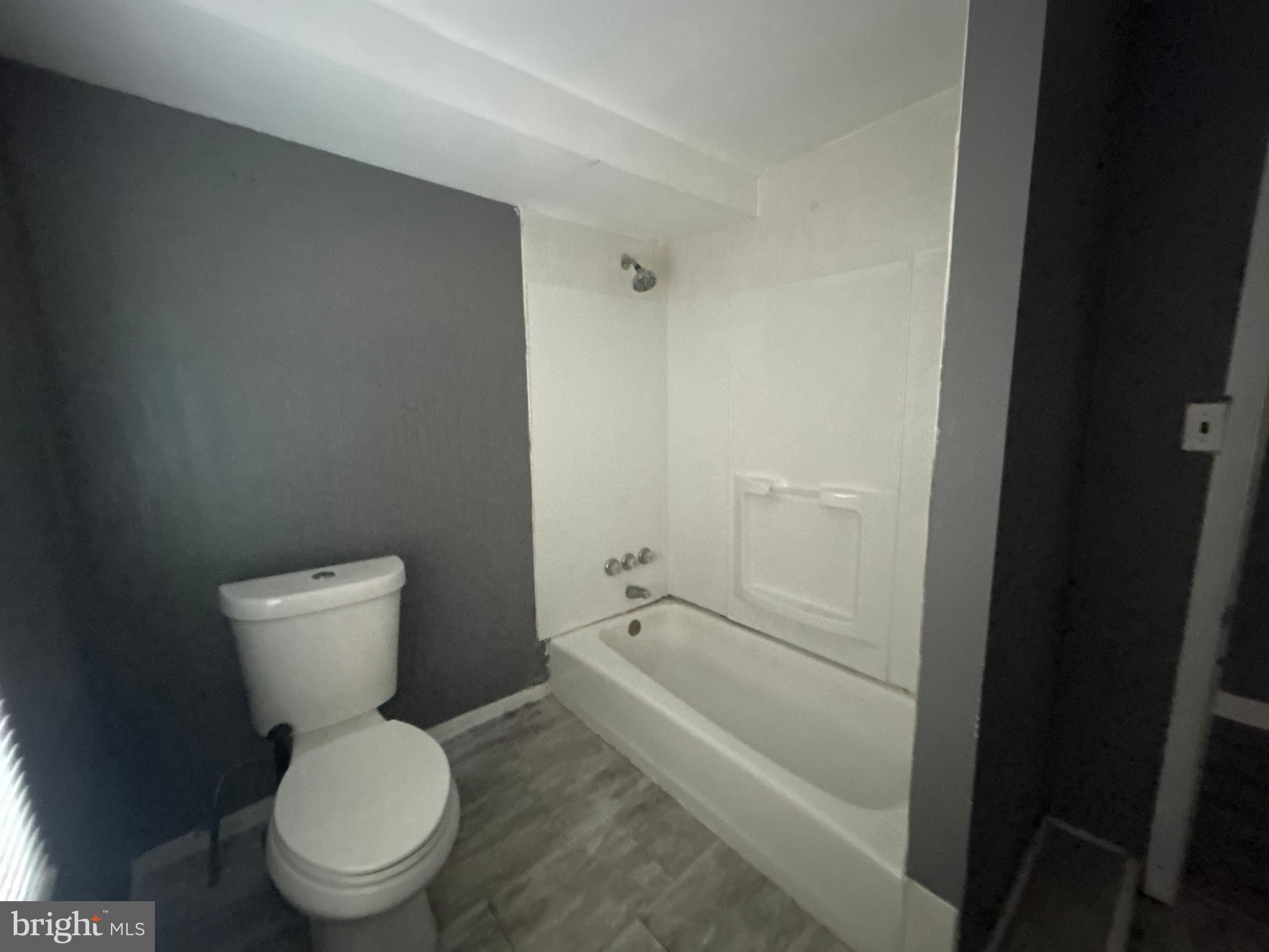 24 West Monroe Street Mount Holly, NJ 08060 - Photo 11 of 20 a white toilet sitting next to a bathroom sink