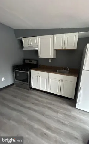 a kitchen with a sink and a stove