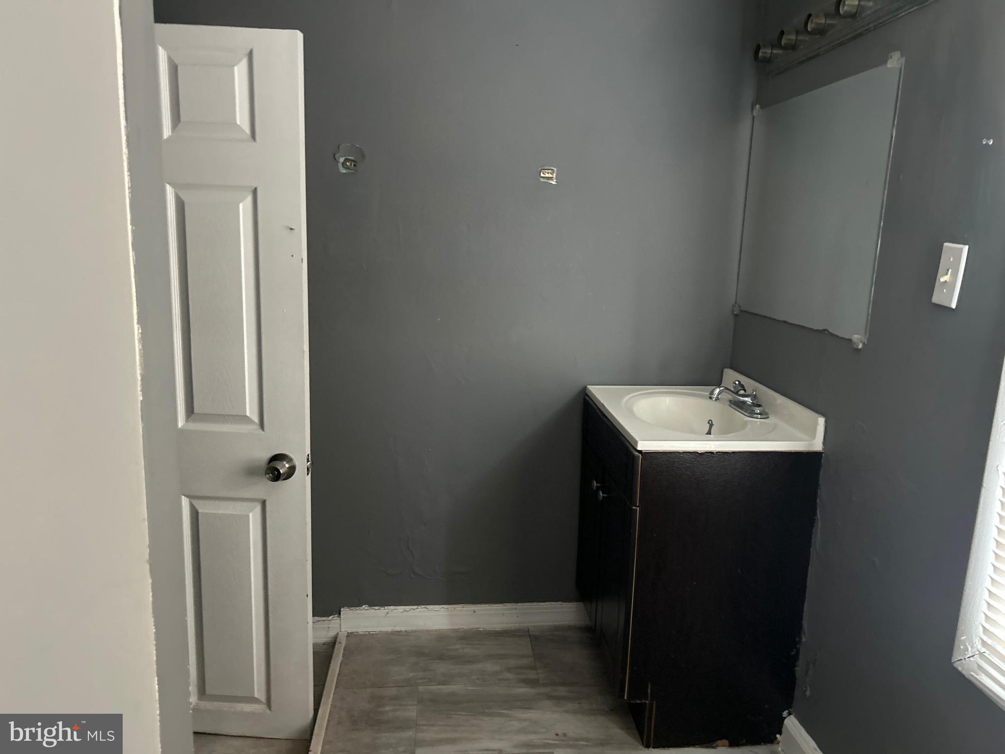 24 West Monroe Street Mount Holly, NJ 08060 - Photo 9 of 20 a bathroom with a sink and mirror
