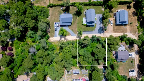 an aerial view of houses with yard
