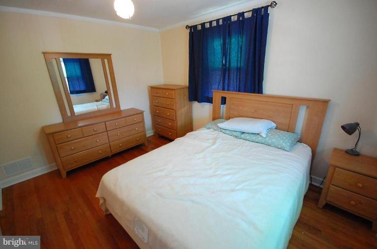 2141 Firethorn Road Middle River, MD 21220 - Photo 2 of 16 a bedroom with bed and window