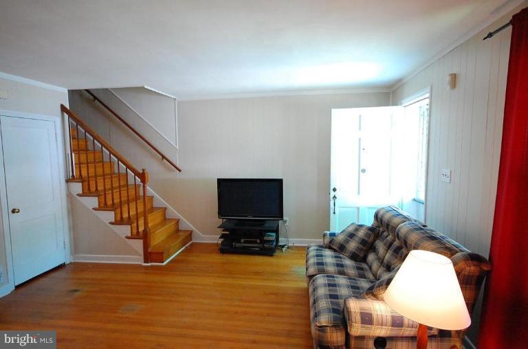 2141 Firethorn Road Middle River, MD 21220 - Photo 11 of 16 a living room with furniture or stairs and a flat screen tv