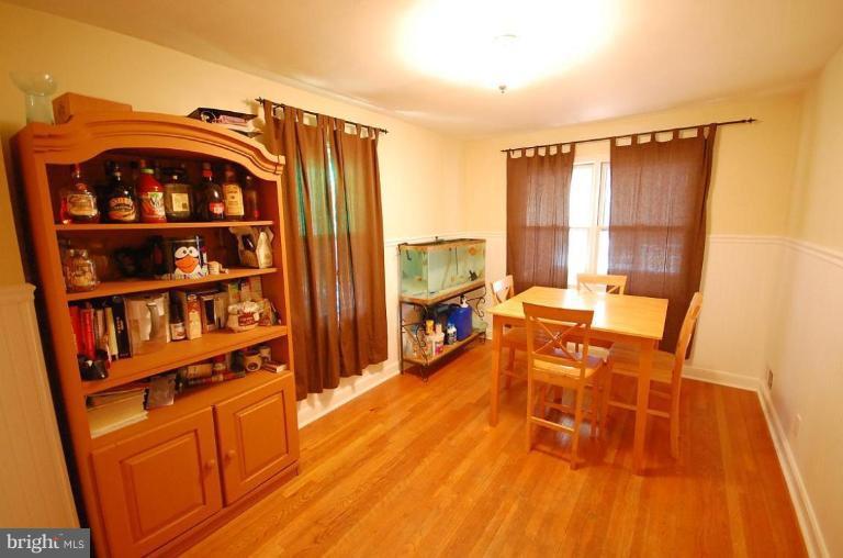 2141 Firethorn Road Middle River, MD 21220 - Photo 6 of 16 a view of a dining room with furniture window and wooden floor