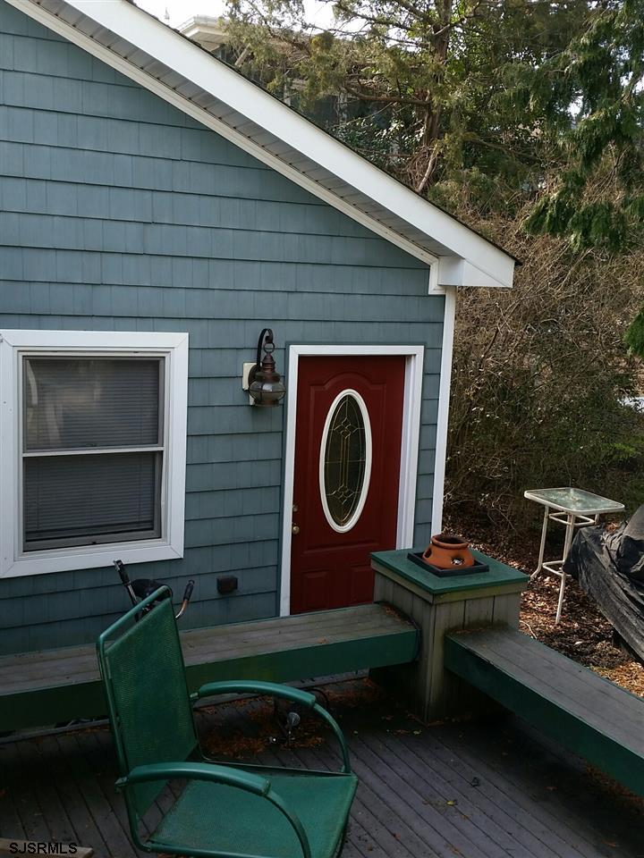 9 Wesley Road Ocean City, NJ 08226 - Photo 11 of 25 a living room with furniture and a fireplace