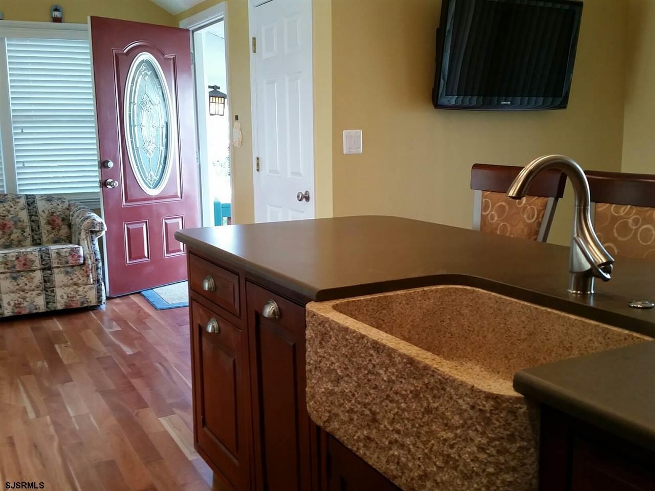 9 Wesley Road Ocean City, NJ 08226 - Photo 18 of 25 a bathroom with a sink and a mirror