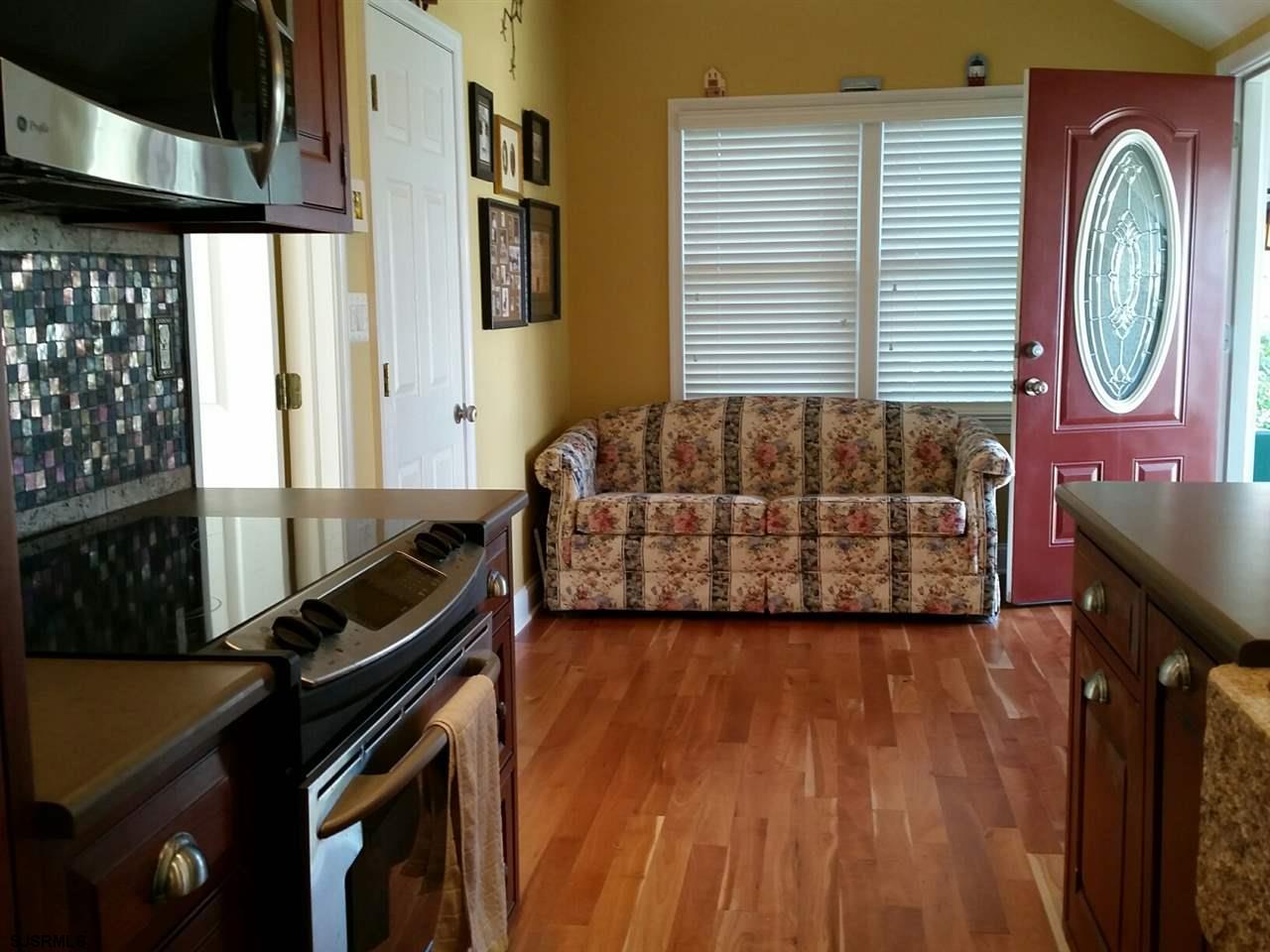 9 Wesley Road Ocean City, NJ 08226 - Photo 19 of 25 a living room with furniture and a wooden floor
