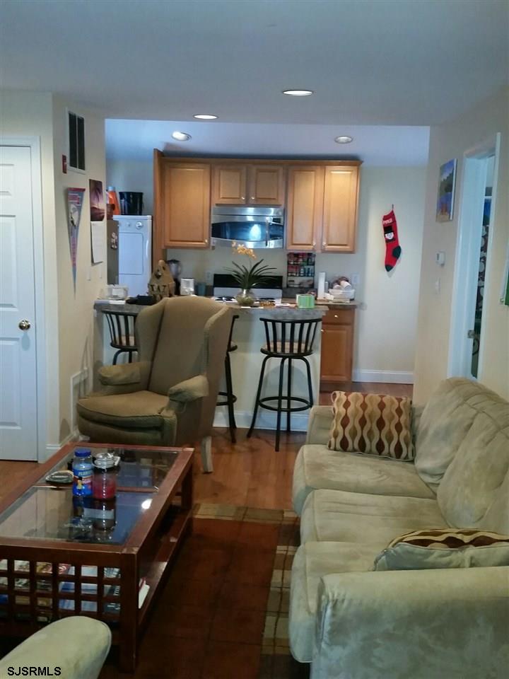 9 Wesley Road Ocean City, NJ 08226 - Photo 8 of 25 a living room with furniture and a flat screen tv