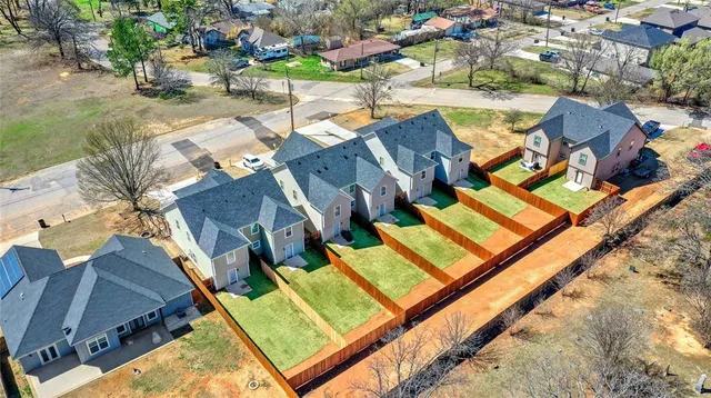 an aerial view of residential house with pool