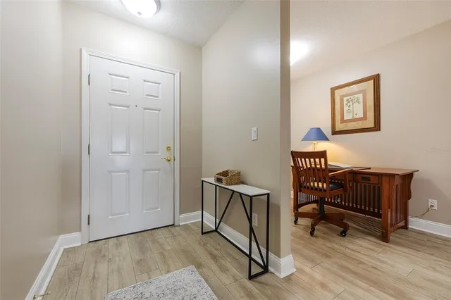 a view of room with window and wooden floor