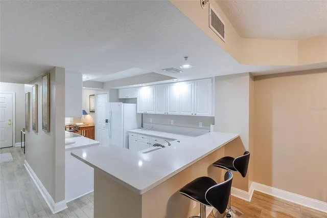 a kitchen with a table and chairs