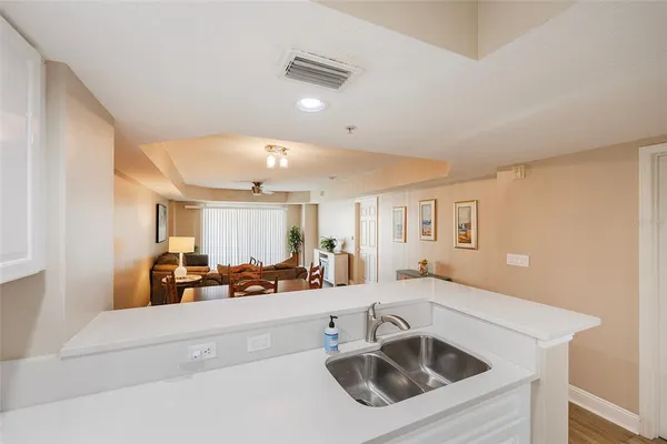 a kitchen with a sink and a refrigerator