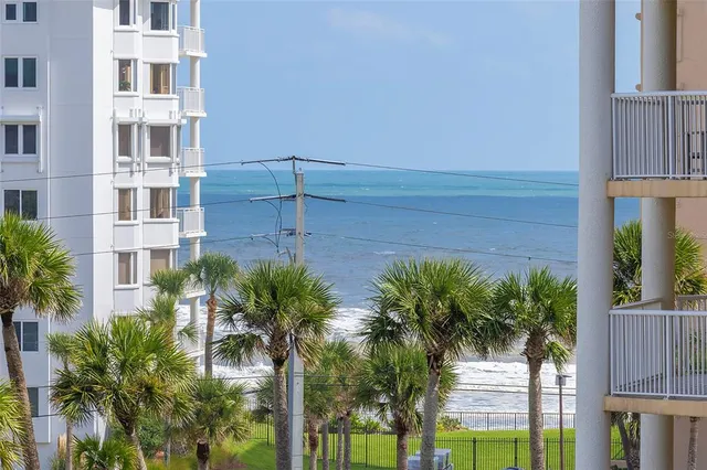 a view of building with yard and staircase