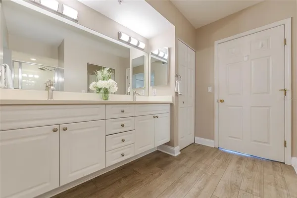 a room with a sink and a mirror