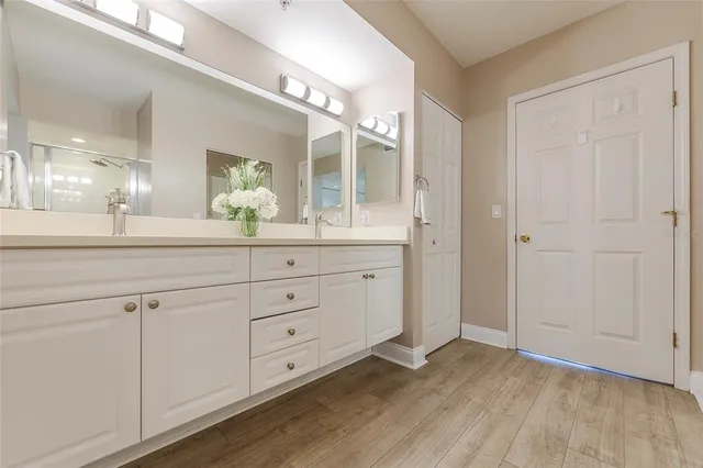 a room with a sink and a mirror