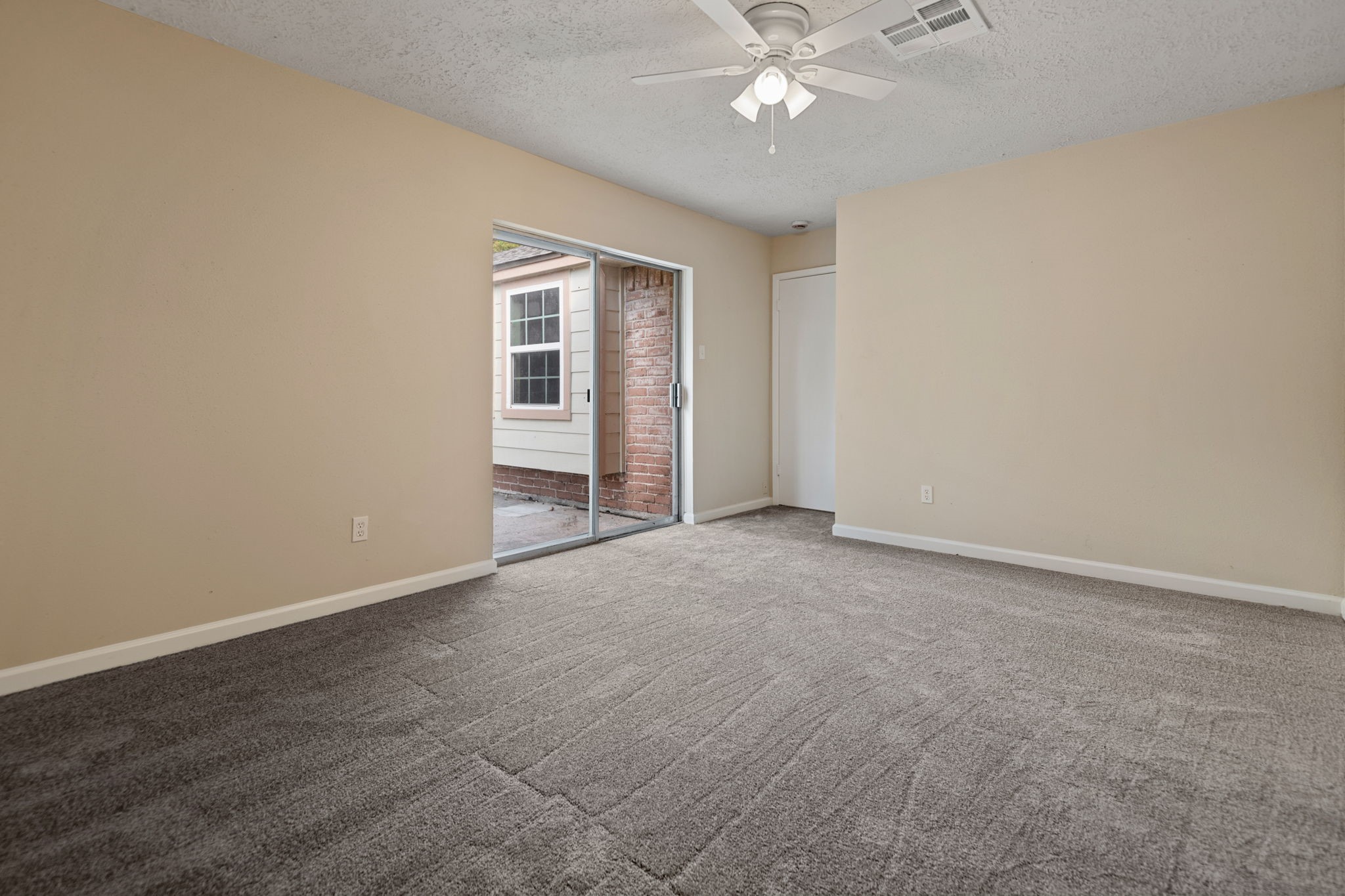13315 Cologne Drive Houston, TX 77065 - Photo 11 of 15 an empty room with a fan & a window