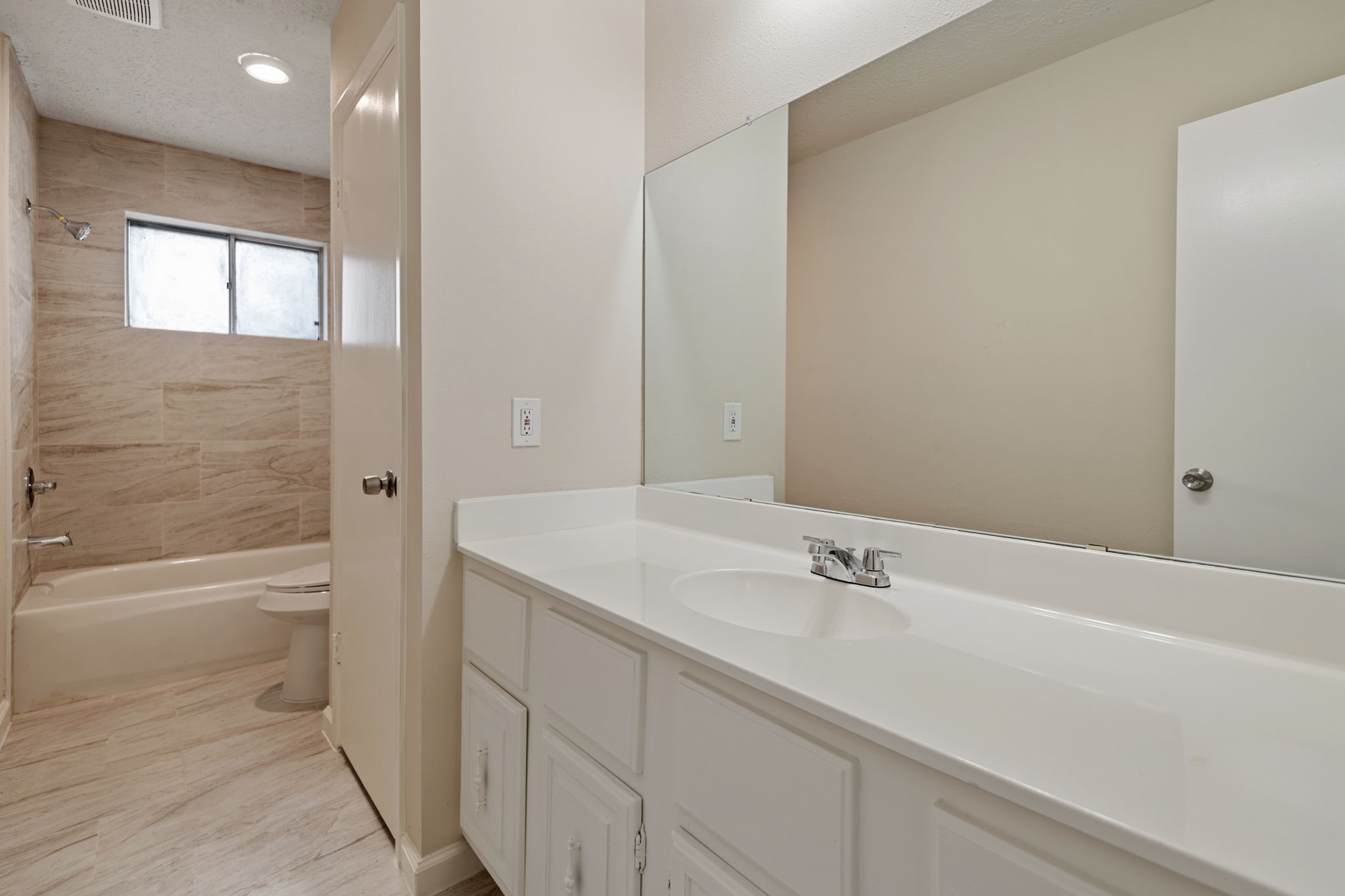 13315 Cologne Drive Houston, TX 77065 - Photo 9 of 15 a bathroom with a sink a toilet and bathtub